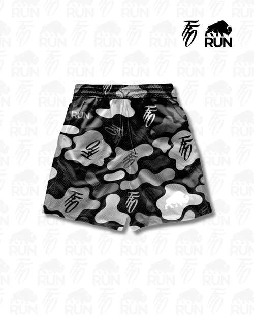 Black and white camouflage shorts with a brand logo on a light gray background